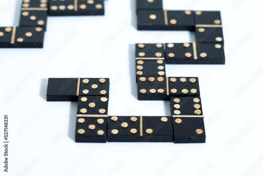 close up of a domino game with black blocks close up of a domino game with black blocks