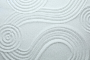 White sand with pattern as background, top view. Zen, meditation, harmony