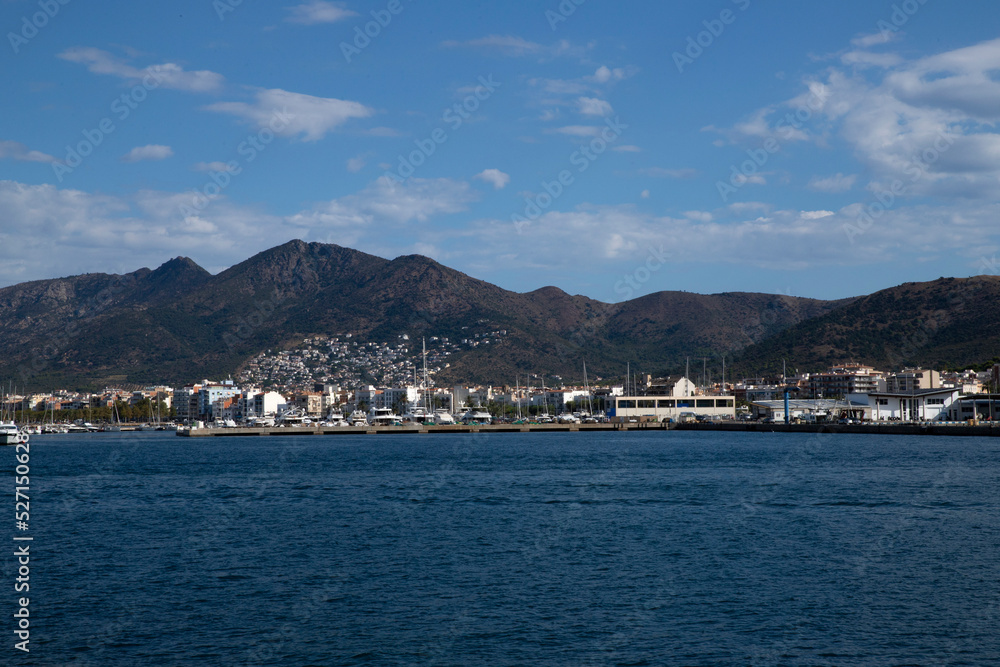 sea ​​view in the city. Skyline on which mountains with houses