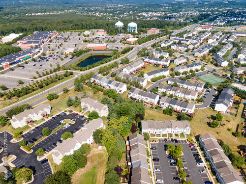 small winding streets, parking lots and roads in a residential area of a small town. Aerial view of