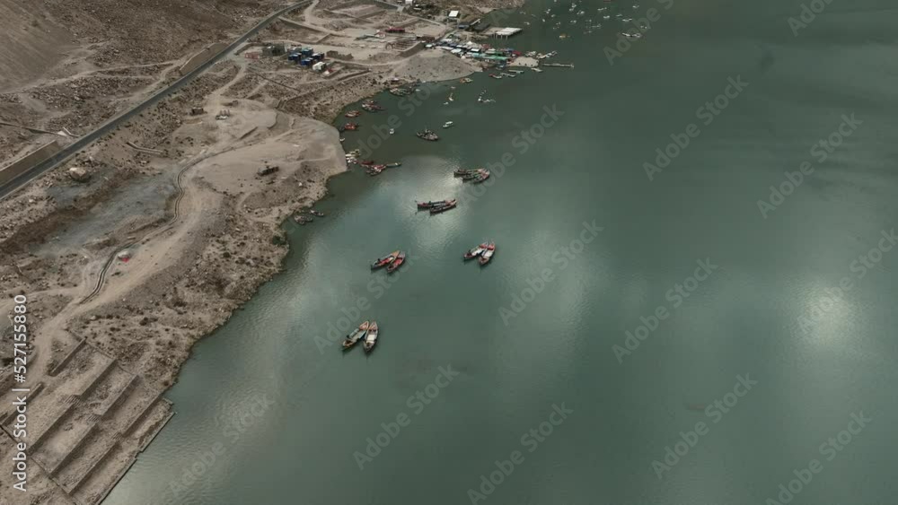 AERIAL 4K, drone flights in top of boats, lake in the Himalaya mountains during sunrise, it goes lower and camera tilts down making a nice close up to them, there are nice reflections in the water AERIAL 4K, drone flights in top of boats, lake in the Himalaya mountains during sunrise, it goes lower and camera tilts down making a nice close up to them, there are nice reflections in the water