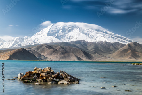 Muztagata snow mountain and Lake Karakul landscape in Kashgar city Xinjiang Uygur Autonomous Region, China. photo