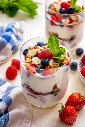Yogurt Parfait Breakfast in a galss with fresh fruits photo