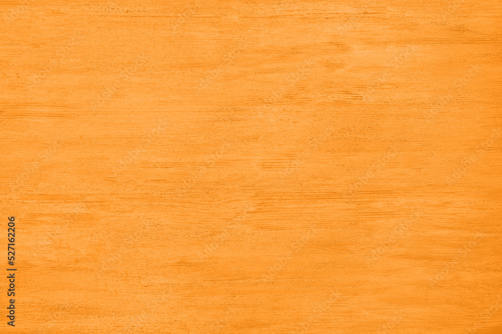 Fototapeta premium Texture of orange wooden surface as background, top view