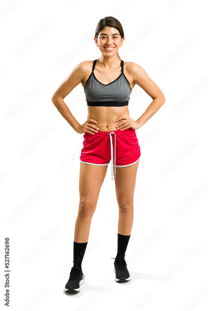 Sporty attractive woman in activewear excited for her cardio workout Sporty attractive woman in activewear excited for her cardio workout