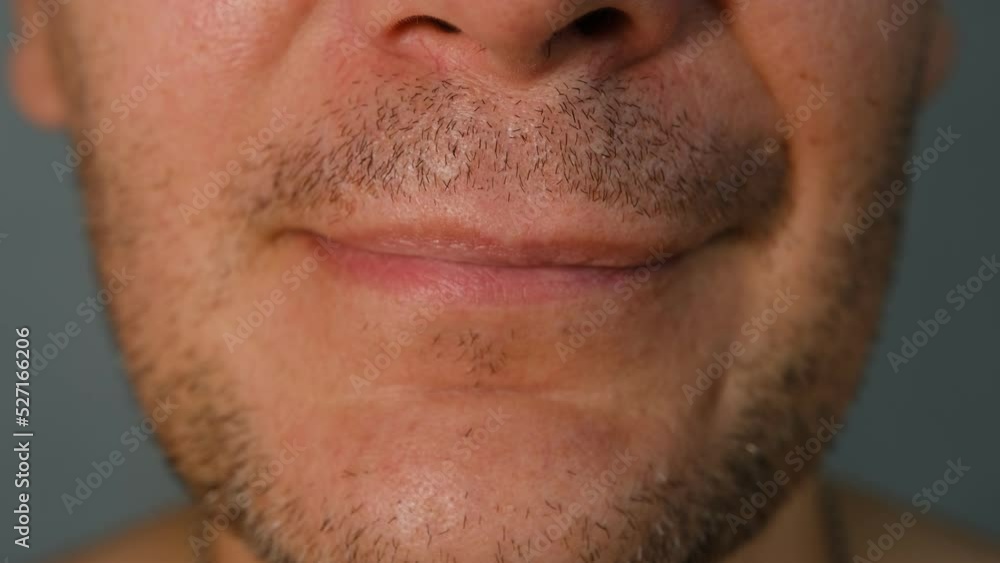 Middle-aged man face fragment, half man face, close up portrait of a middle aged man on grey background, grey eyes close up. Middle-aged man face fragment, half man face, close up portrait of a middle aged man on grey background, grey eyes close up.