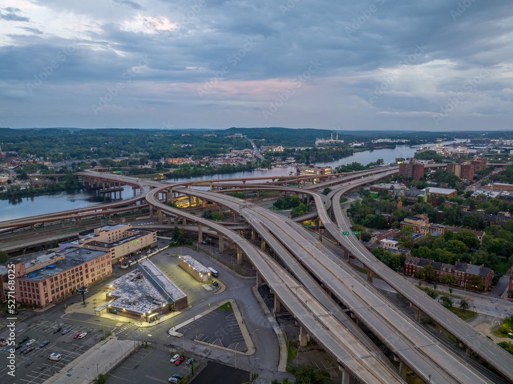 Aerial sunset view of the Dunn Memorial Bridge, interstate 787 complex intersection in Albany next to the Hudson river
