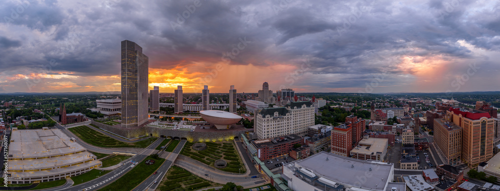 Gorgeous orange cloudy sunset sky after the rain over the government center of Albany New York