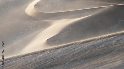 Windswept desert sand dunes in Xinjiang, China photo