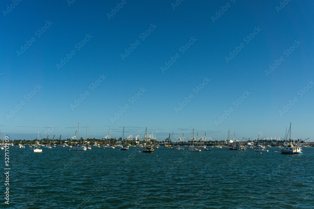 Seascape of the coast of Miami with several sailboats anchored. Miami, State of Florida, USA.
