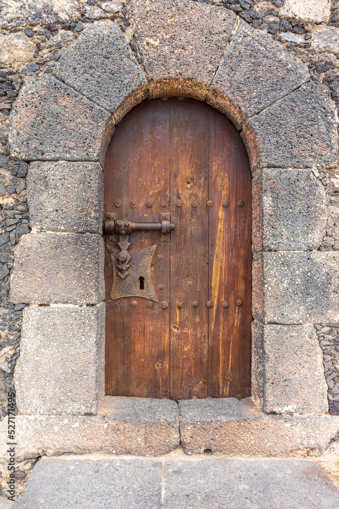 Antique wooden door. Entrance to the fortress. Antique wooden door. Entrance to the fortress.