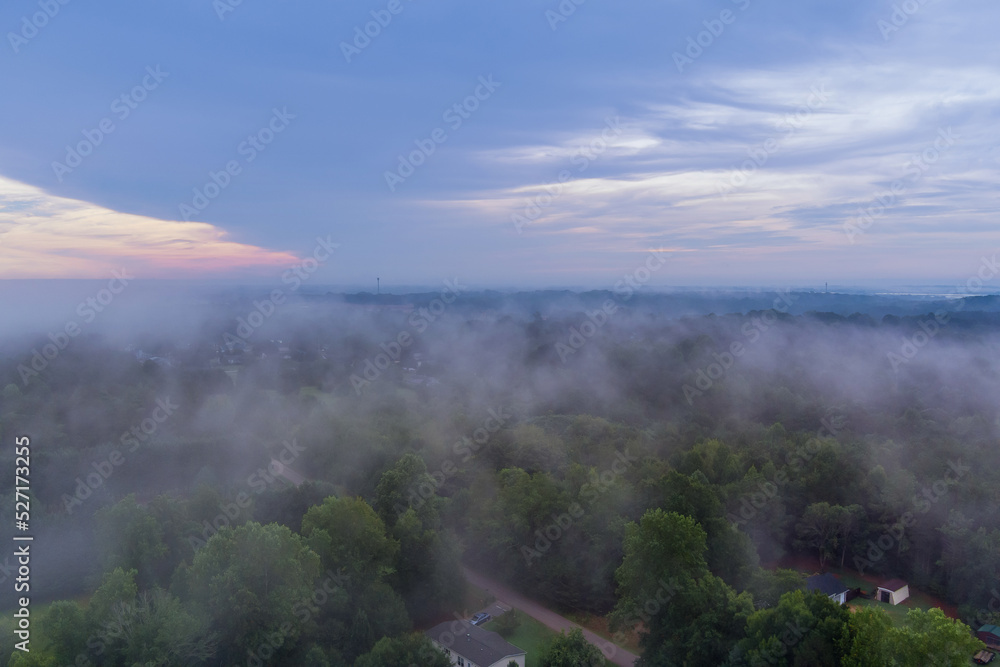 During the summer season in South Carolina, morning fog the town village houses is foggy on mornings