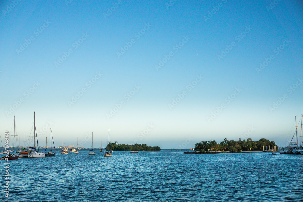 Seascape of island a sailboats at the coast of Miami, State of Florida, USA.