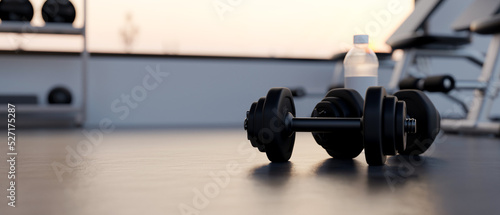 Fototapeta Naklejka Na Ścianę i Meble -  close-up, Dumbbells and mockup space on a gym floor over blurred modern fitness gym in background