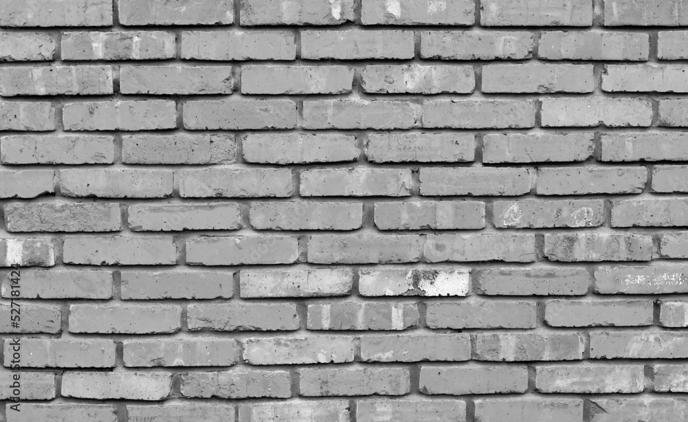 Grey brick wall texture background. Tiled.