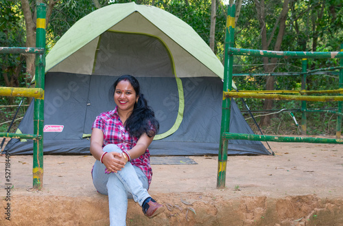 Asian, Indian woman travel and camping alone at natural park in India. Recreation and journey outdoor activity lifestyle concept. photo