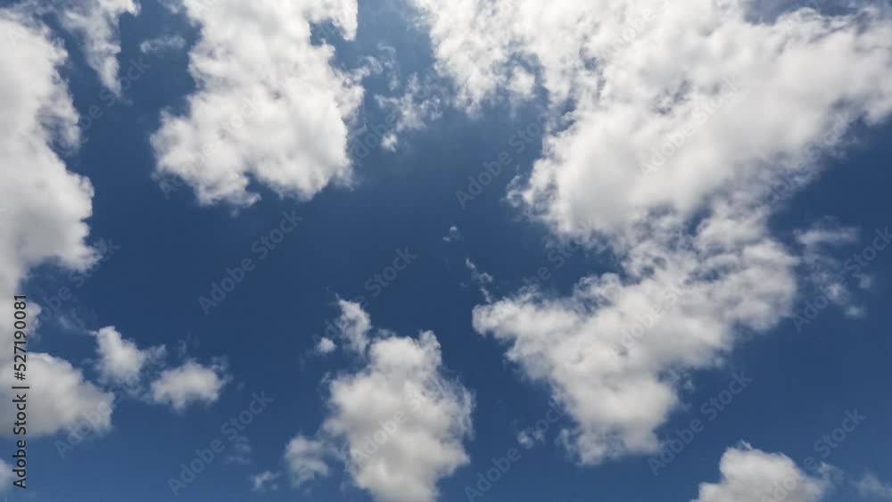 Timelapse of fluffy white clouds with blue sky on sunny day. Timelapse of fluffy white clouds with blue sky on sunny day.