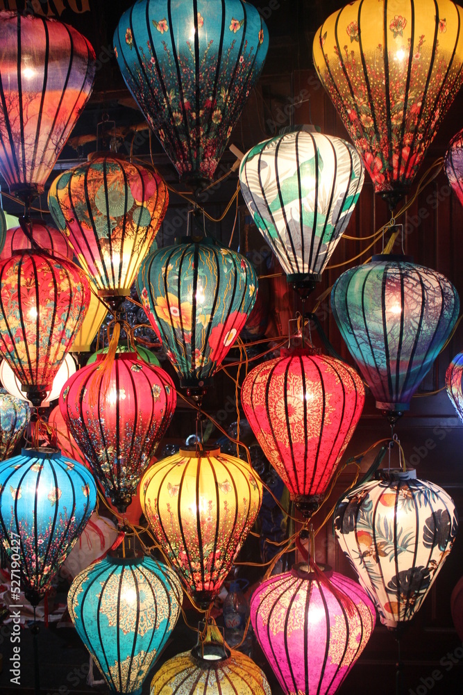 Colorful lanterns in a night market in Asia. Home lanterns decoration from Vietnam. Traditional lights.	