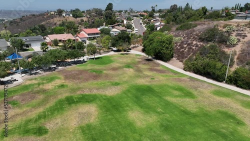 Aerial View of Ralph Dailard Elementary School Playground Yard, San Carlos Community San Diego California, Green Field and Sports Schoolyard next to Residential Neighborhood Area photo