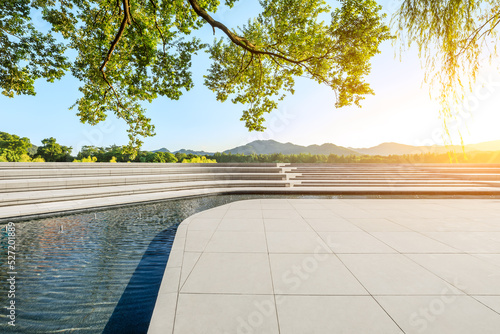 Square floor and green tree with mountain background © ABCDstock