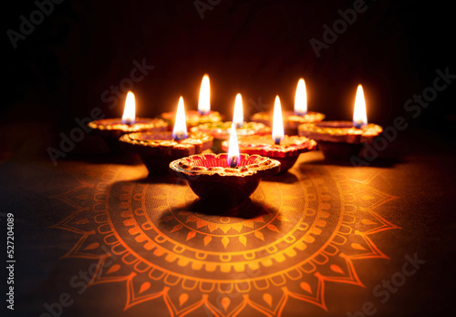 Diwali, Deepavali Hindu festival of lights. Diya lamp lit on black, copy space