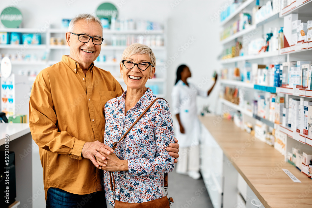 Portrait of happy senior couple in pharmacy looking at camera. Portrait of happy senior couple in pharmacy looking at camera.