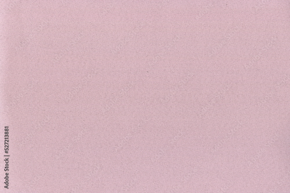 The texture of natural dense fabric is light pink. Dense fabric background. The texture of natural dense fabric is light pink. Dense fabric background.