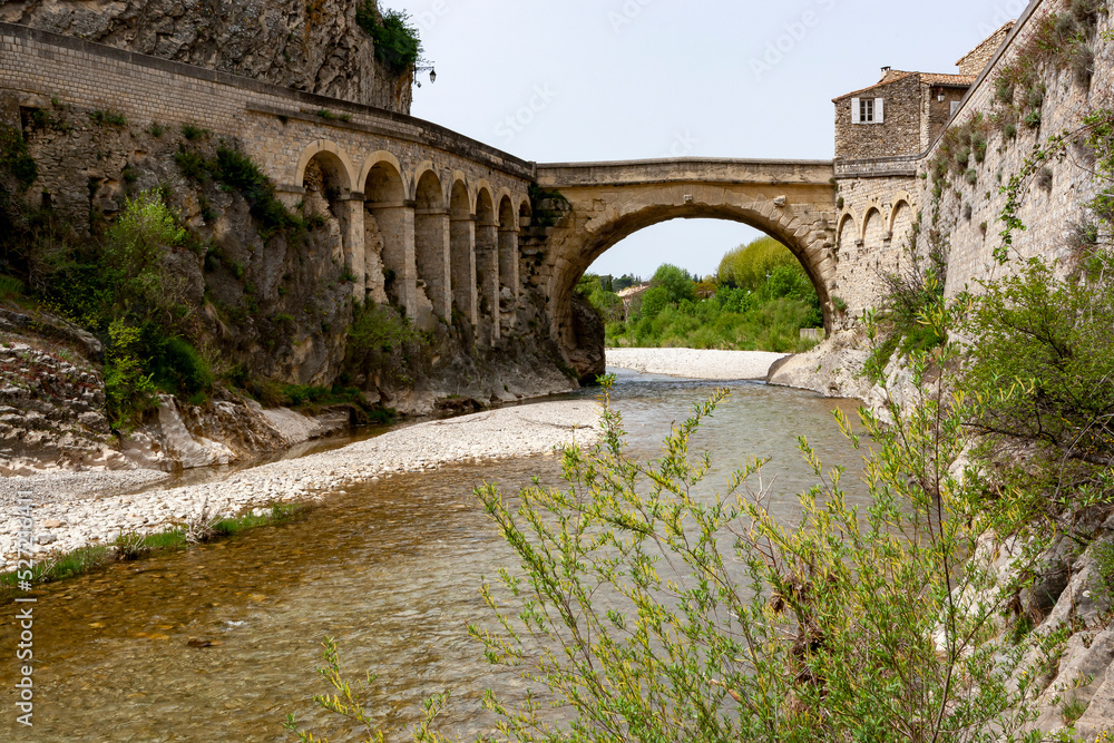 View of the old bridge of Vaison la Romaine village in Provence, France