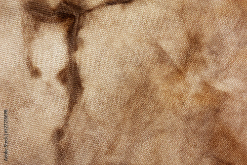 Old fabric with brown stains full frame for background, murder case idea, old blood stains on fabric,cream brown abstract
