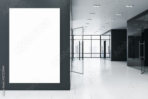 Obraz na plátně Modern new office corridor interior with glass windows and city view, concrete flooring and empty white mock up poster on wall