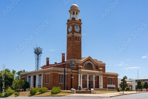 An historic courthouse with a tall clock tower and cupola photo