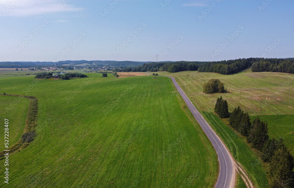 Aerial view of agro rural fields. Harvesting on the farm landscape