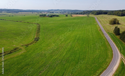 Aerial view of agro rural fields. Harvesting on the farm landscape