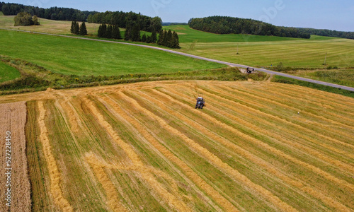 Aerial view of agro rural fields. Harvesting on the farm landscape