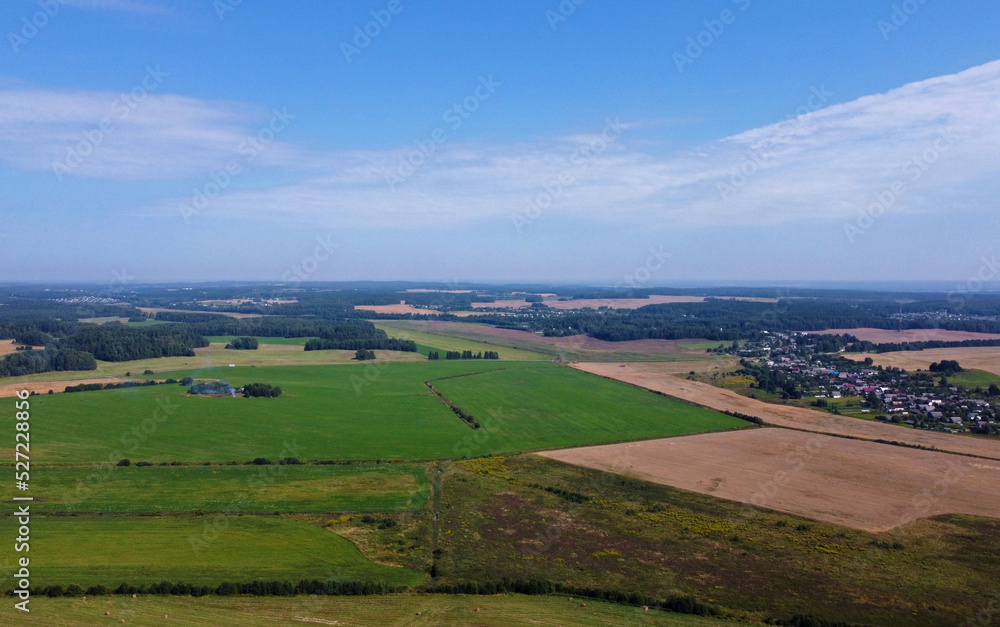 Aerial view of agro rural fields. Harvesting on the farm landscape