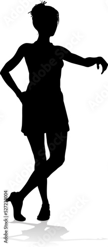 A woman looking relaxed leaning against something in silhouette