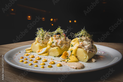 Typical Peruvian appetizer with mashed potatoes and spicy sauce. Fototapet