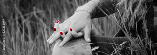 Intertwined hands of a couple in love. A gesture of love. 