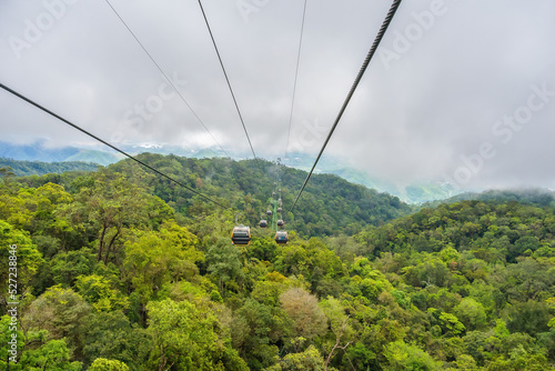 Cable cabs are running on high wire at Bana Hills in Danang, Vietnam. Bana Hills is interesting tourist new places to visit in Da Nang city, Vietnam