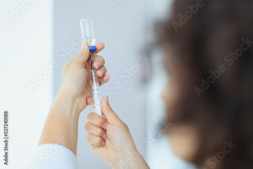 Nurse with syringe with covid vaccine