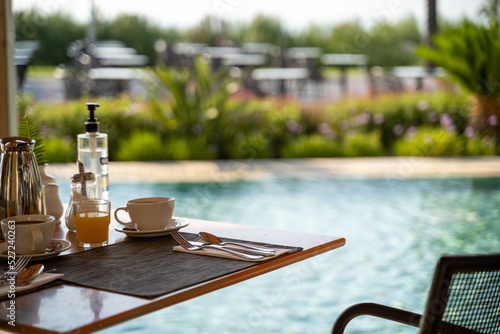 Table near the swimming pool in the restaurant