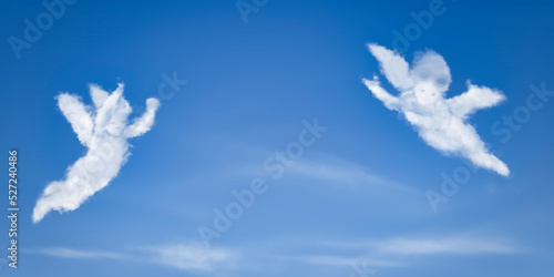 Angel flying in the sky. Angel-shaped cloud