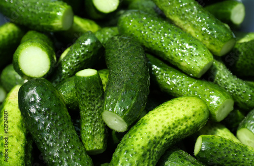 Many fresh ripe cucumbers as background  closeup
