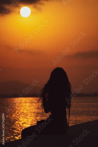 Sunset in Deltebre. Woman silhouette.
