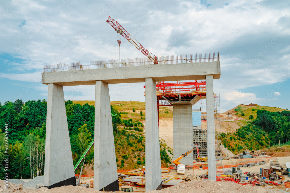 Constructing concrete pillars of the bridge. Construction of the new ...