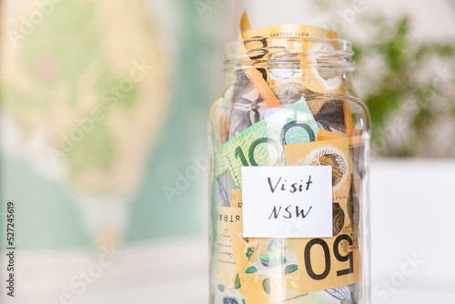 visit NSW - money in a jar for tourist to save up to visit New South Whales photo