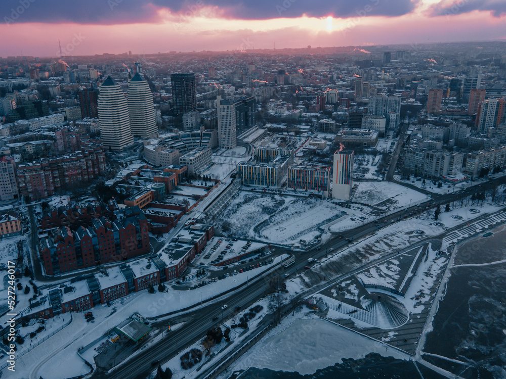 Dnipro, Ukraine. View of the central part of the city, the embankment of the Dnieper. Winter top view from a great height. Panoramic view of the city. Snow, cold.