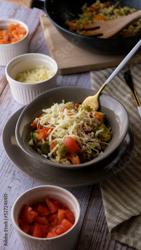 preparation of rice with vegetables and cheese