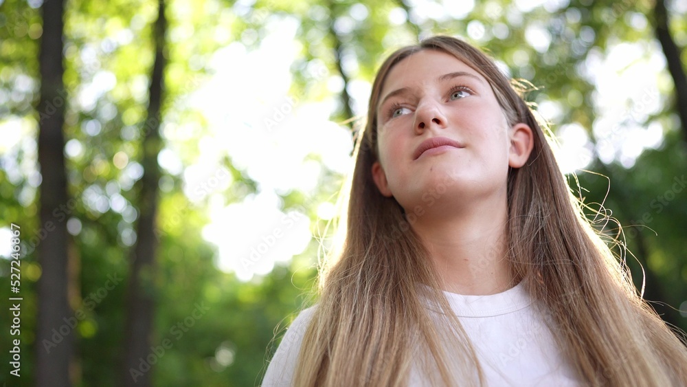 happy teenage girl portrait in the park. teenager wants a dream portrait at sunset. woman daughter silhouette dreams of a happy childhood in the forest park. independence girl teenager concept freedom