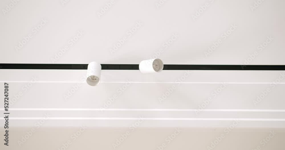 Minimalist suspended ceiling and plasterboard construction in decorating the apartment or house with modern white lamps. video with dolly. Modern Ceiling with Lamp. Minimalist Interior Minimalist suspended ceiling and plasterboard construction in decorating the apartment or house with modern white lamps. video with dolly. Modern Ceiling with Lamp. Minimalist Interior